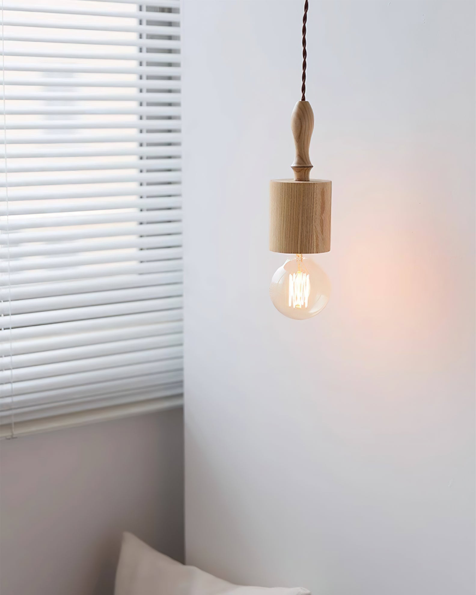 Cano Pendant Light shown in a minimalist living room setting.