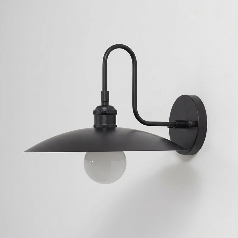 Cantina Wall Lamp used as a reading light in a study.