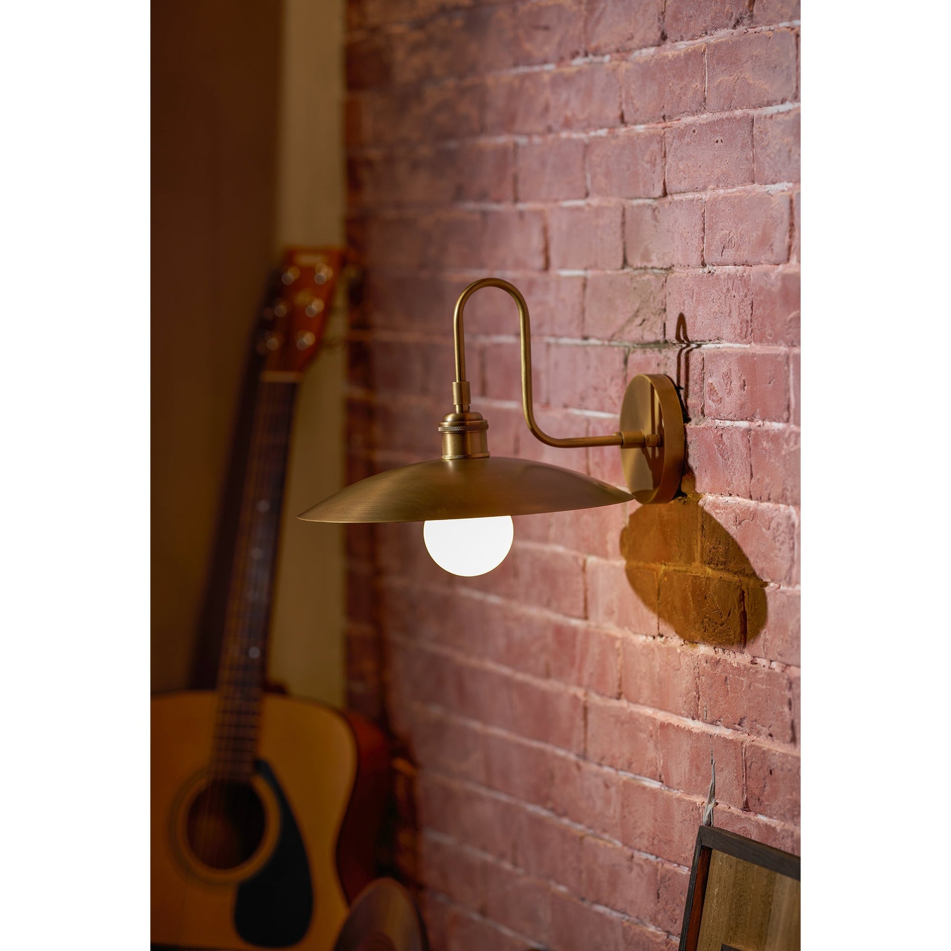 The antique brass reflector detail, showing its warm tone.