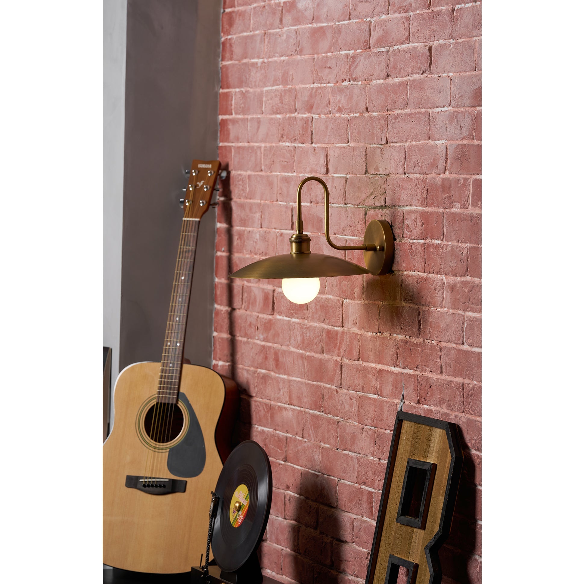 The modernist design of the Cantina Wall Lamp highlighted from an angle.