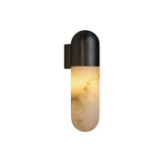Capsule Alabaster Wall Lamp with black metal housing.