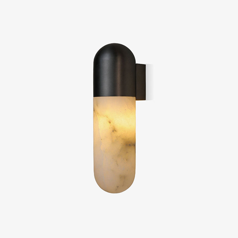Brass finish wall lamp in a luxurious bedroom setting.