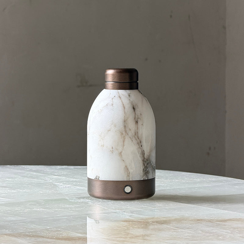 Dark Bronze Capsule Table Lamp on a wooden desk.