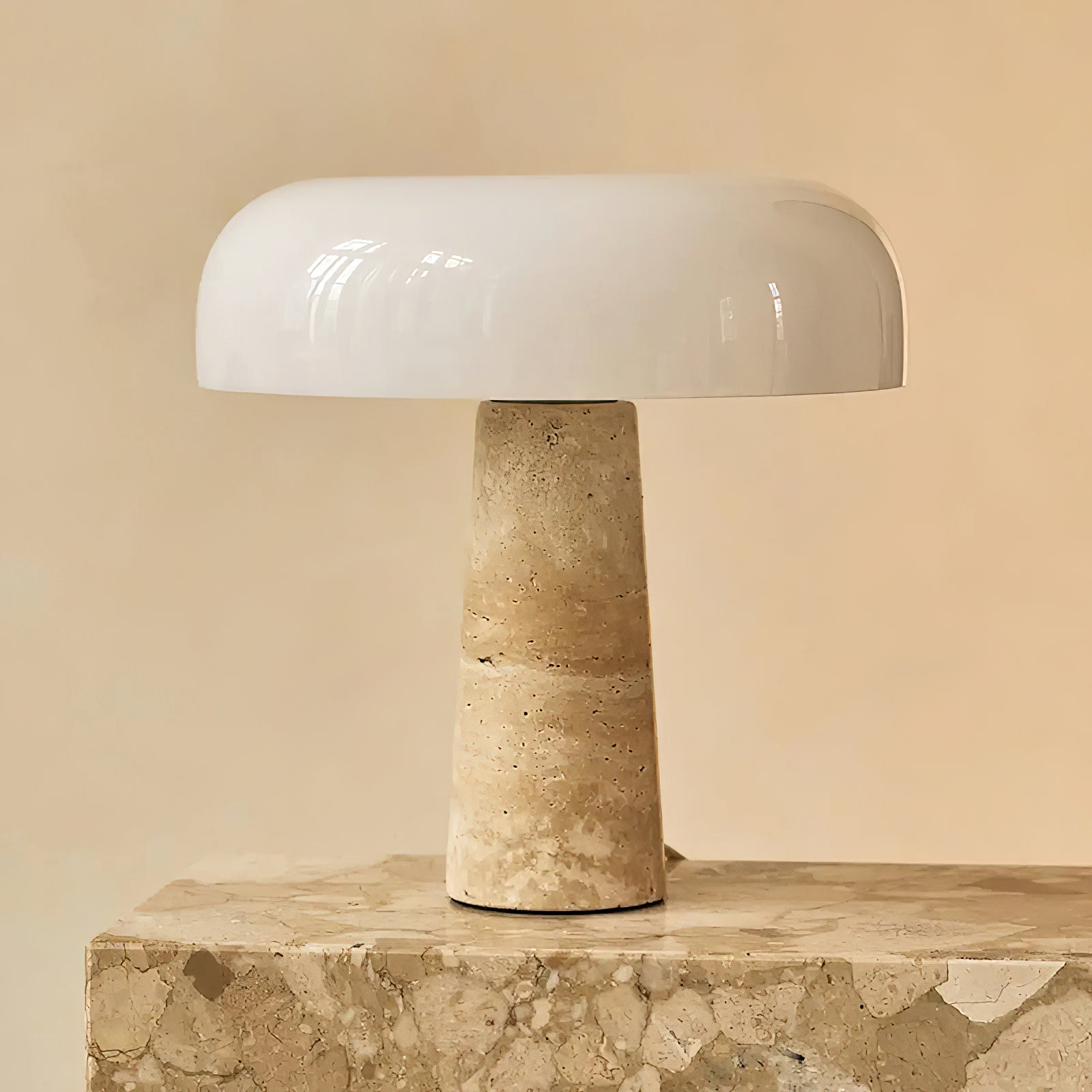 Close-up of the junction between the glass shade and stone base.