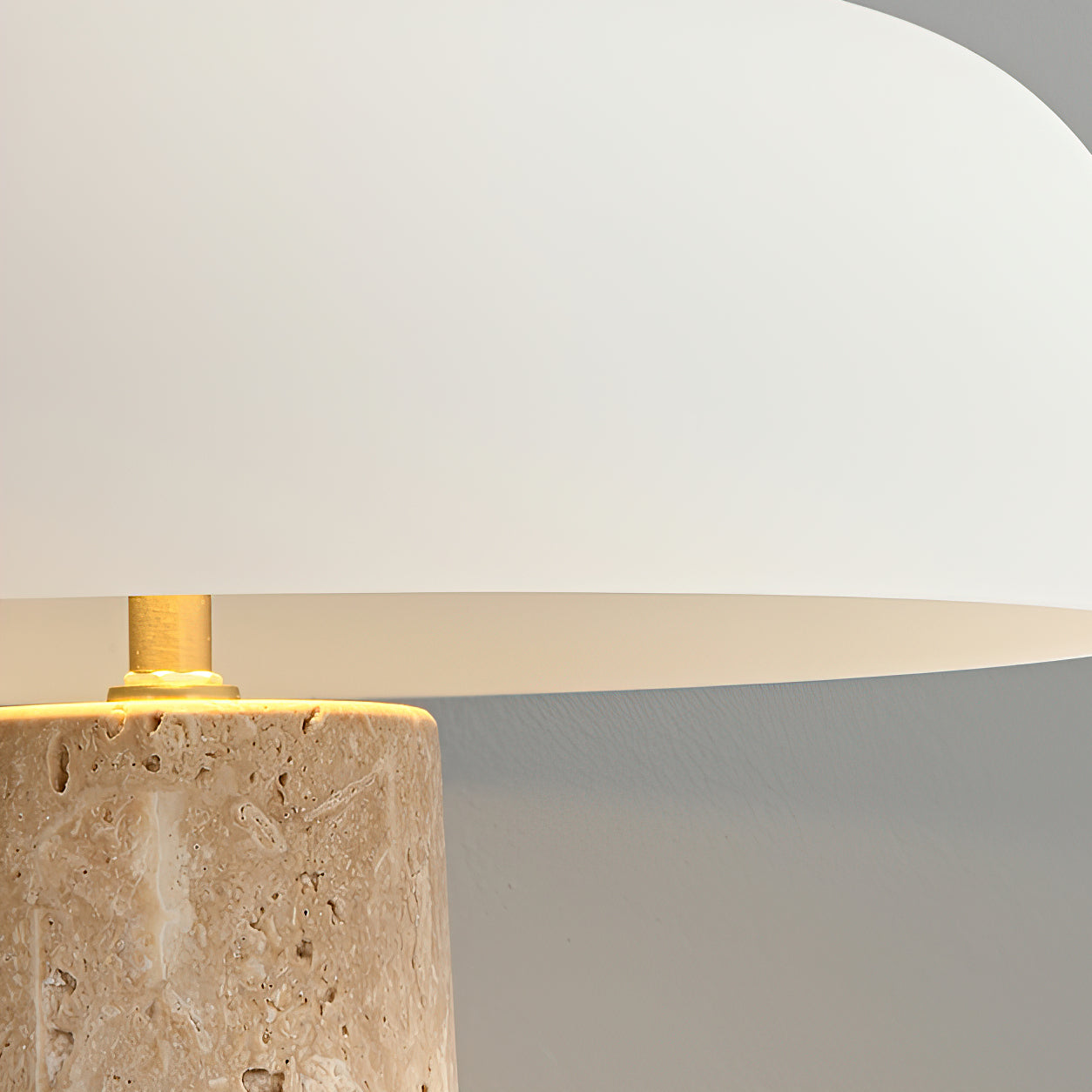 The lamp illuminating a small area on a console table.