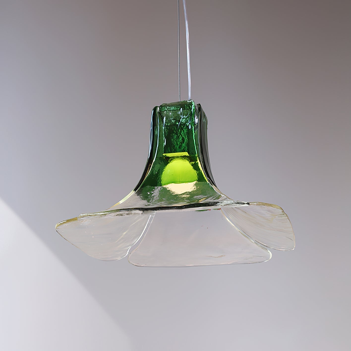 Side profile of the smoky gray and clear Carlo Pendant Light.