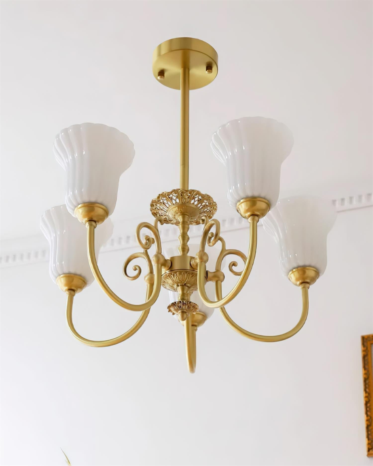 Chandelier with Brass Arms White Glass Shades Opulent Luxe