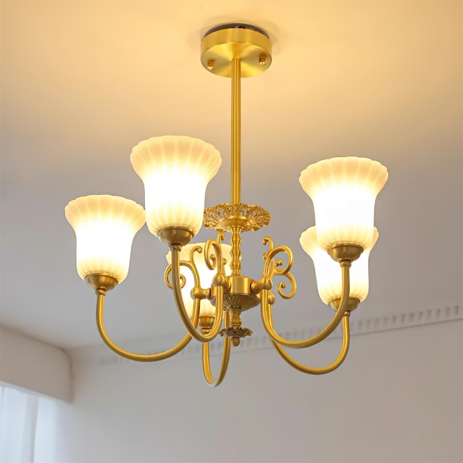 Chandelier with Brass Arms White Glass Shades Opulent Luxe