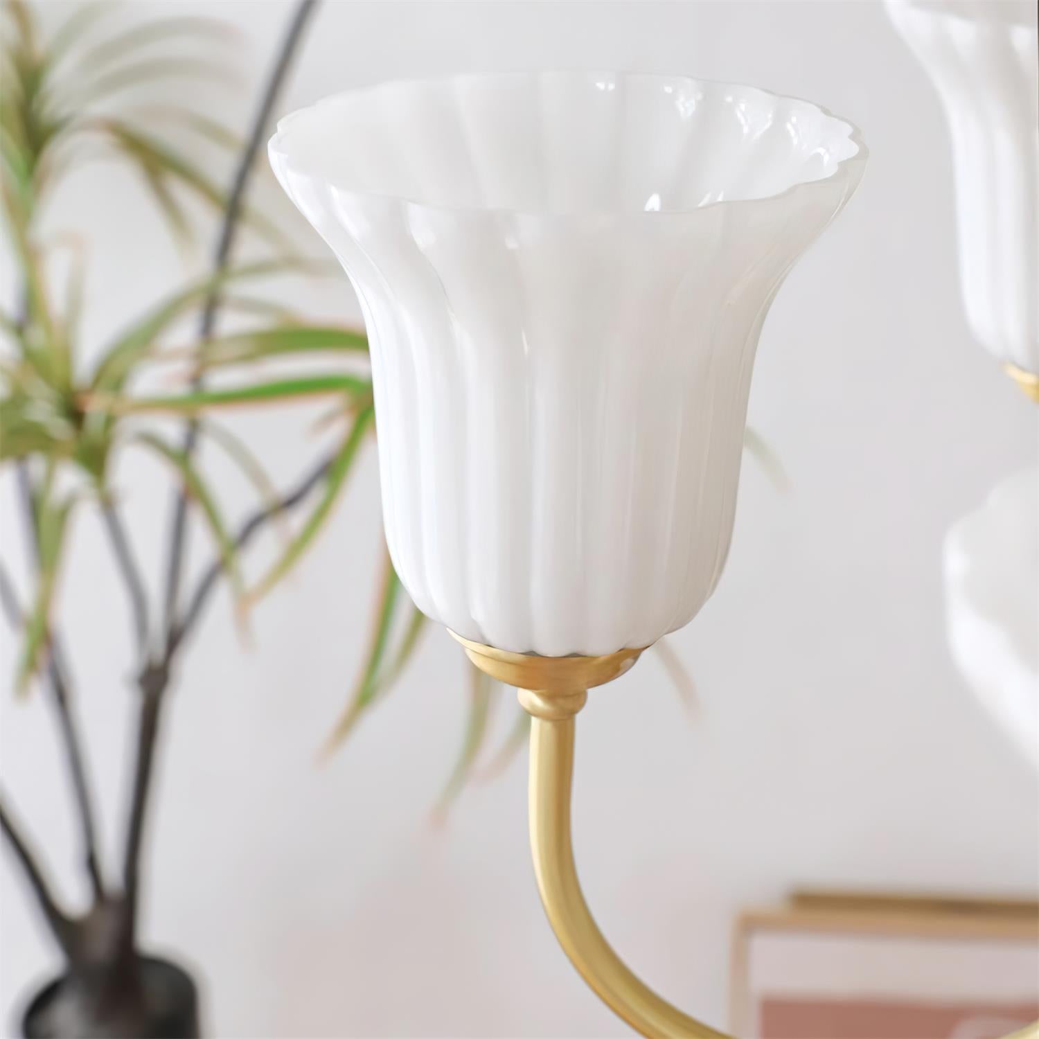 Chandelier with Brass Arms White Glass Shades Opulent Luxe