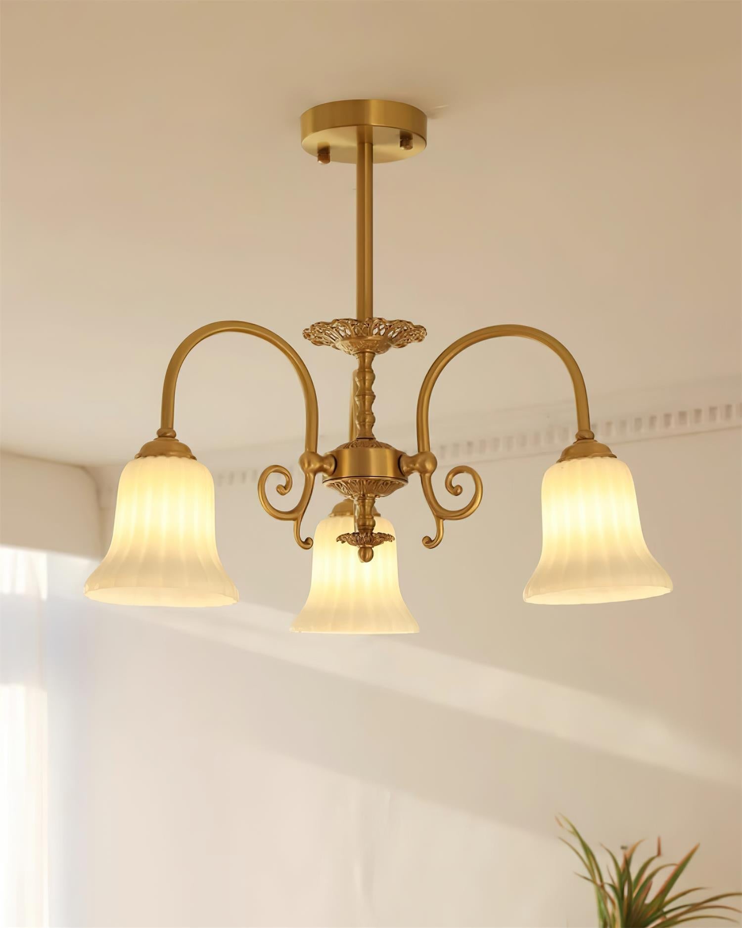 Chandelier with Brass Arms White Glass Shades Opulent Luxe