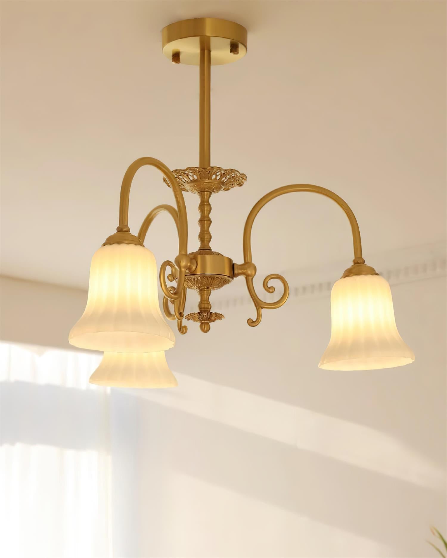 Chandelier with Brass Arms White Glass Shades Opulent Luxe