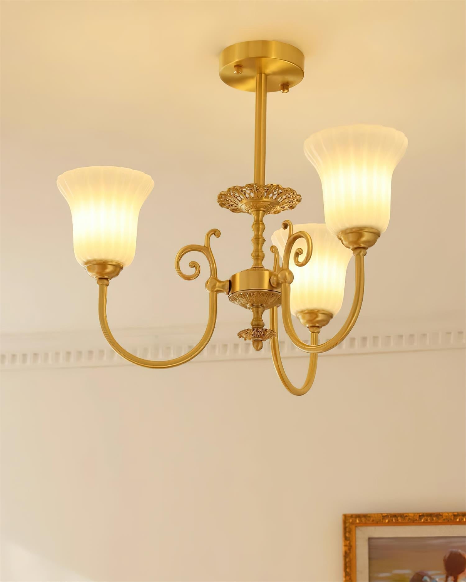 Chandelier with Brass Arms White Glass Shades Opulent Luxe