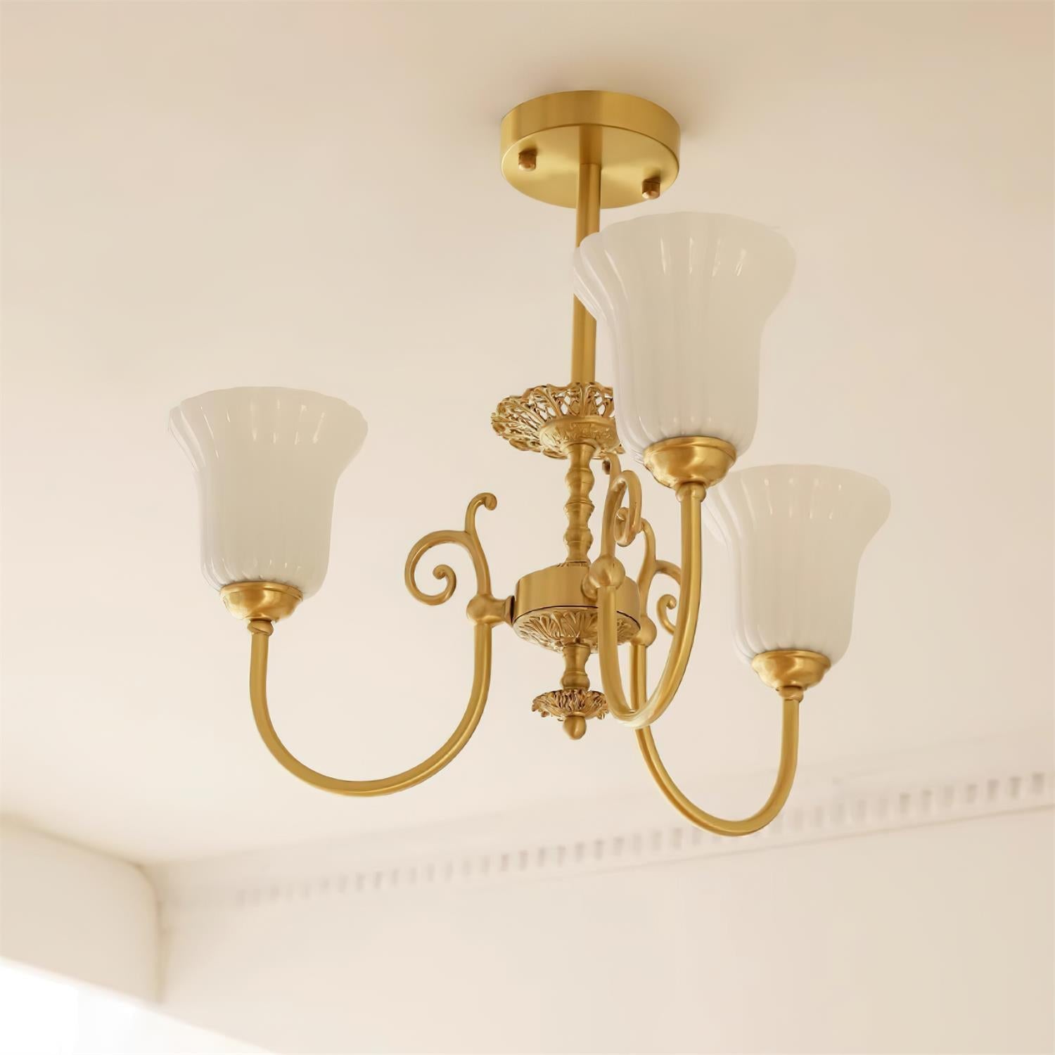 Chandelier with Brass Arms White Glass Shades Opulent Luxe