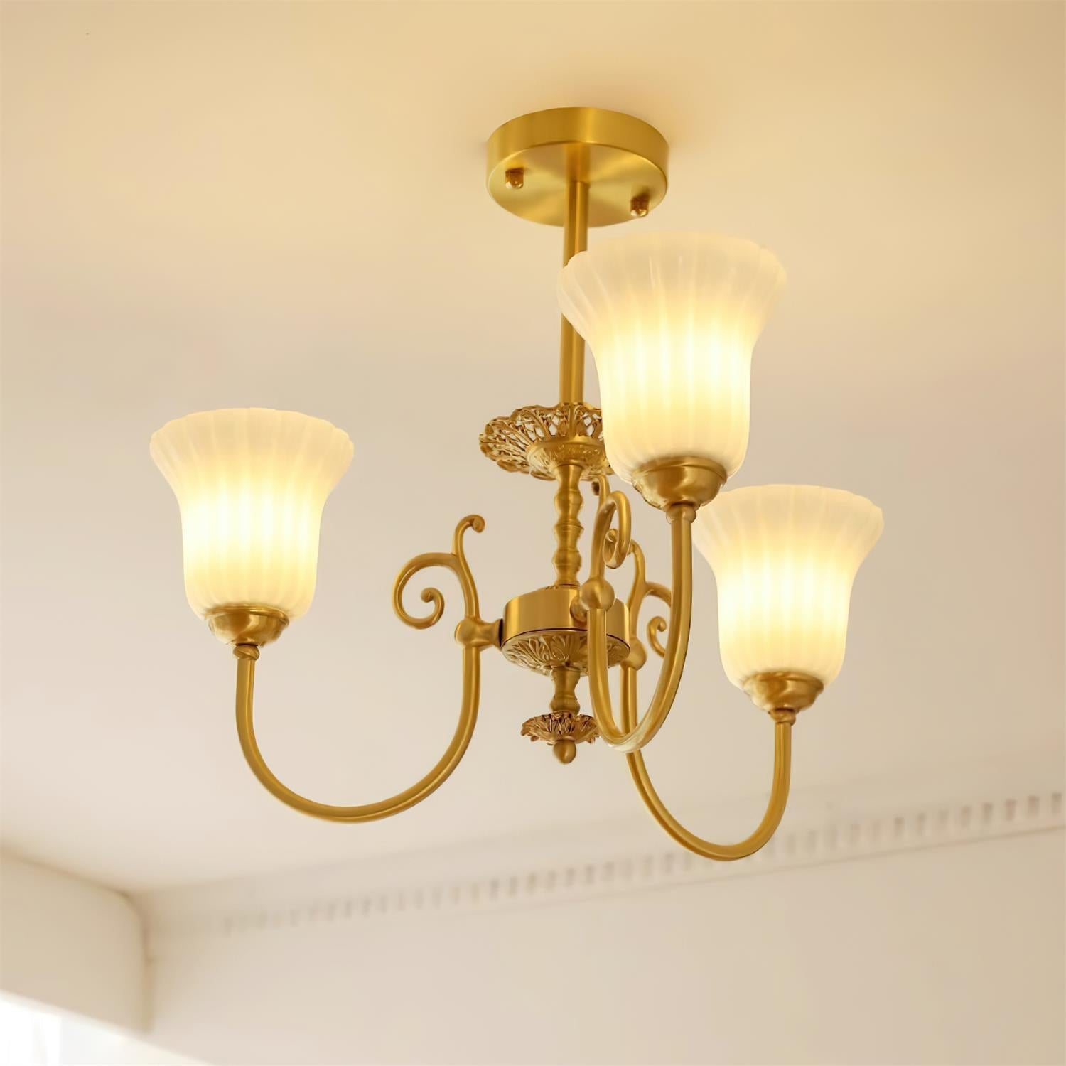 Chandelier with Brass Arms White Glass Shades Opulent Luxe