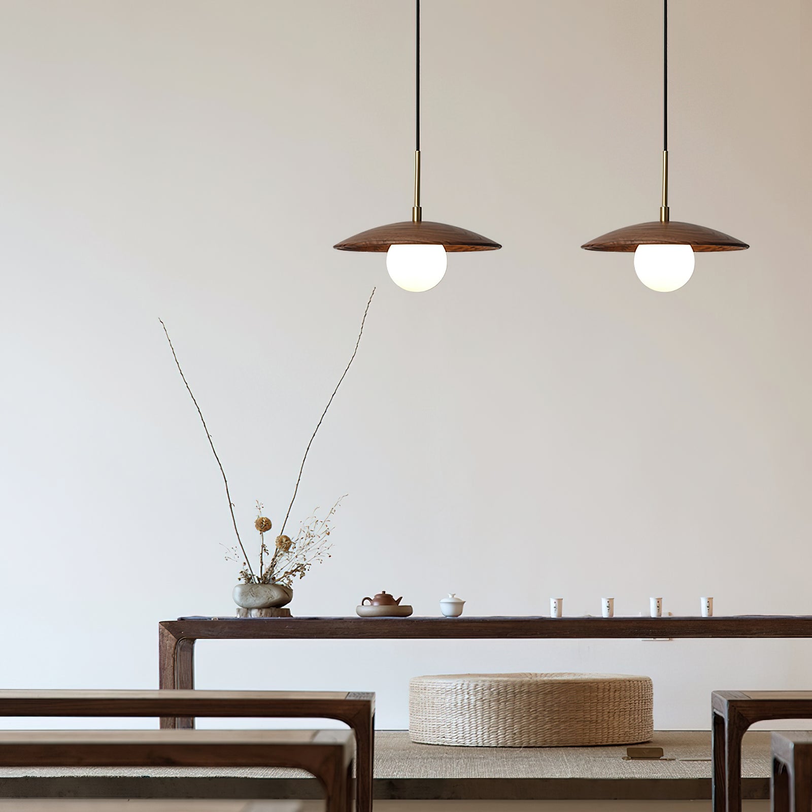 Close-up of the Caroll Pendant Light's white globe and wooden shade.