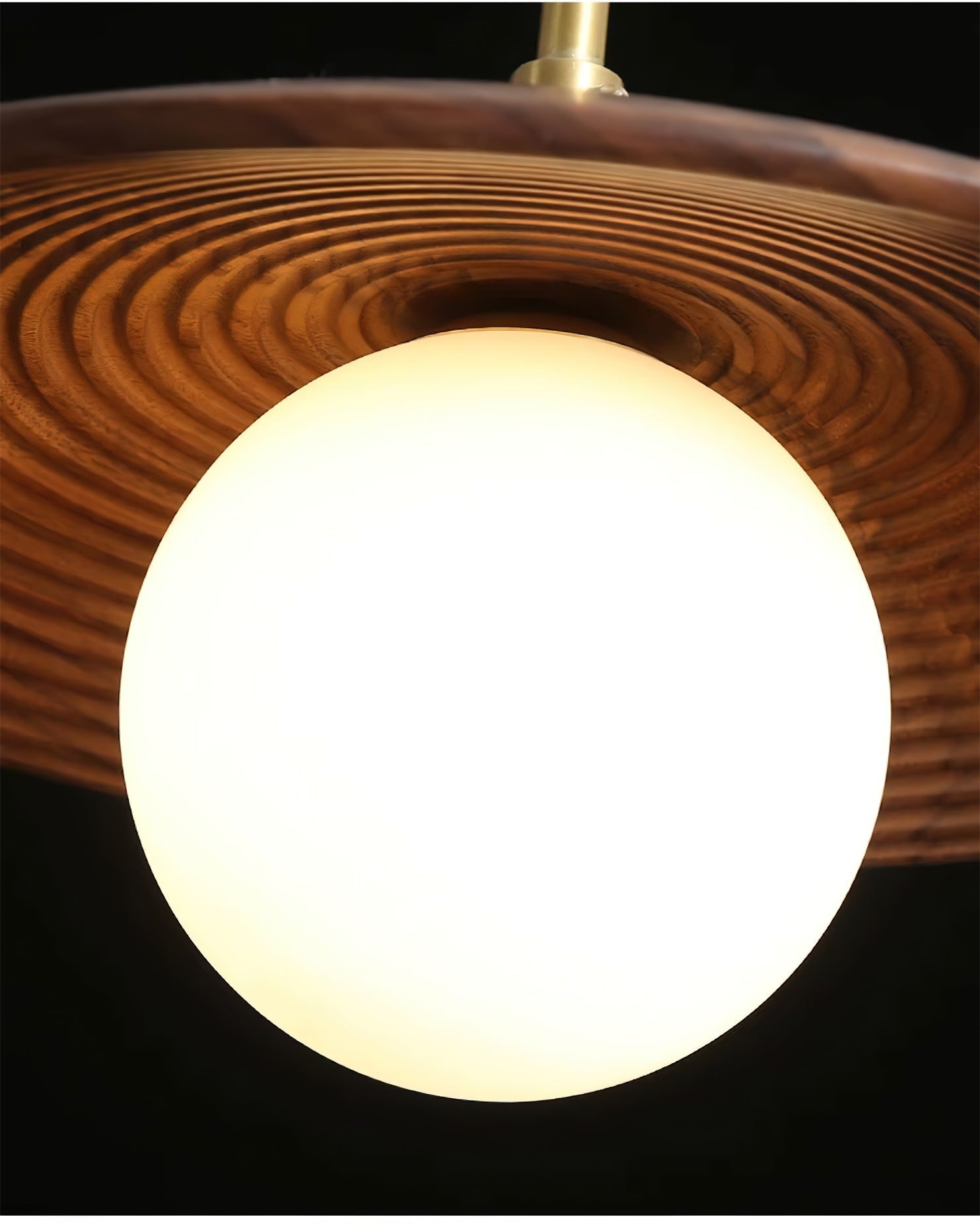 The brass hardware and wooden components of the Caroll Pendant Light.