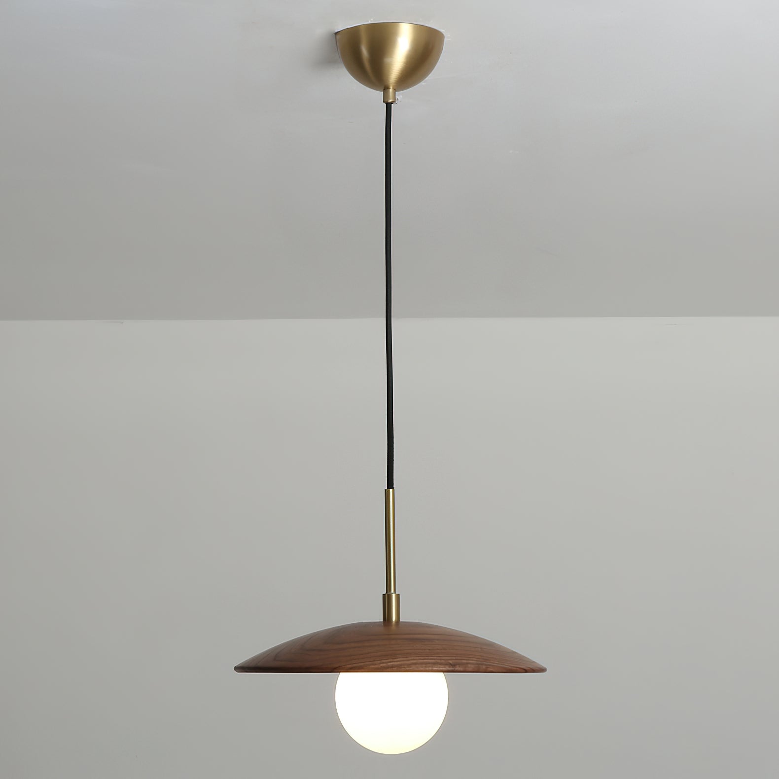 The Caroll Pendant Light in a cozy, well-lit interior space.