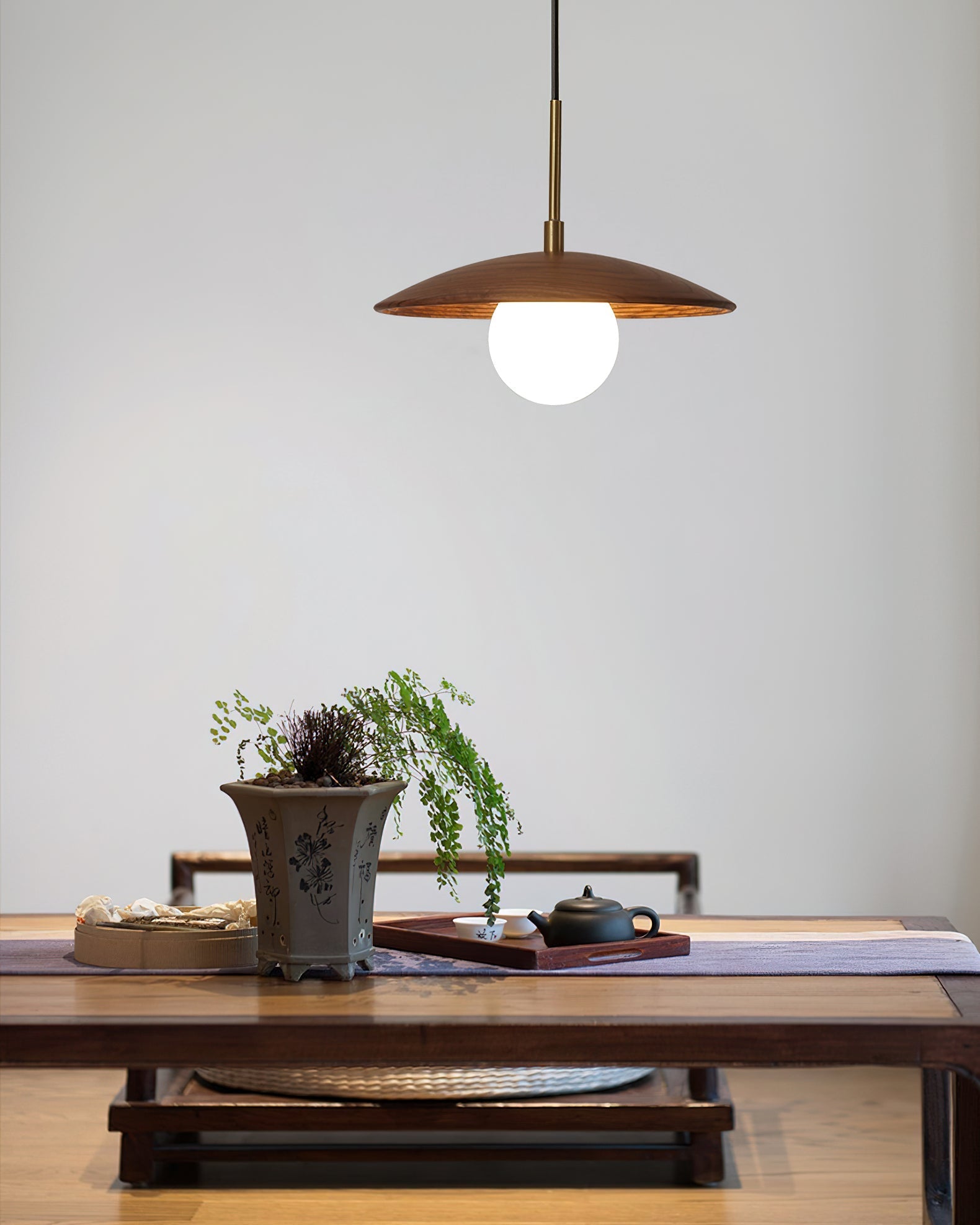 Caroll Pendant Light hanging in a modern living room.