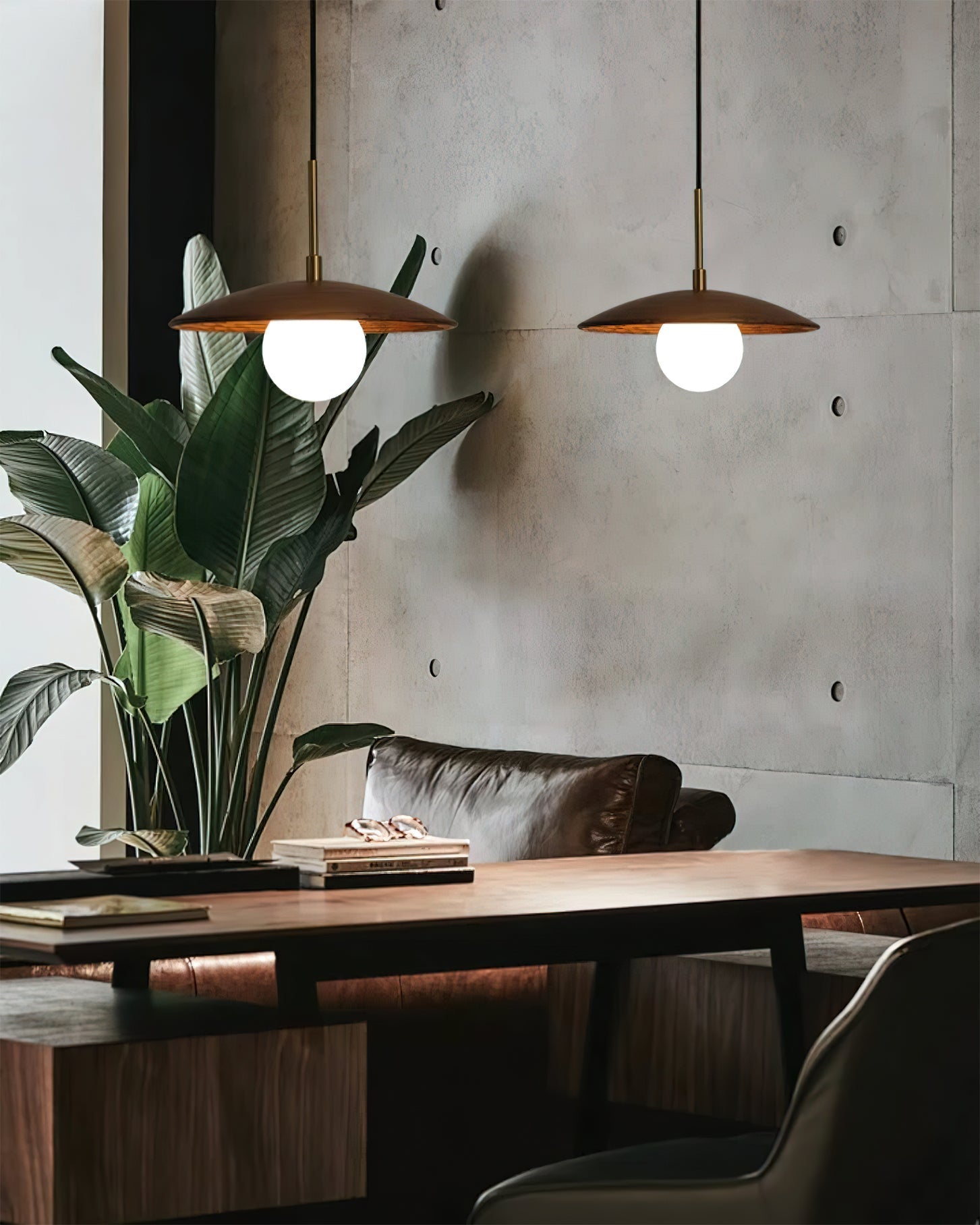 The Caroll Pendant Light illuminated, casting a warm and inviting glow.