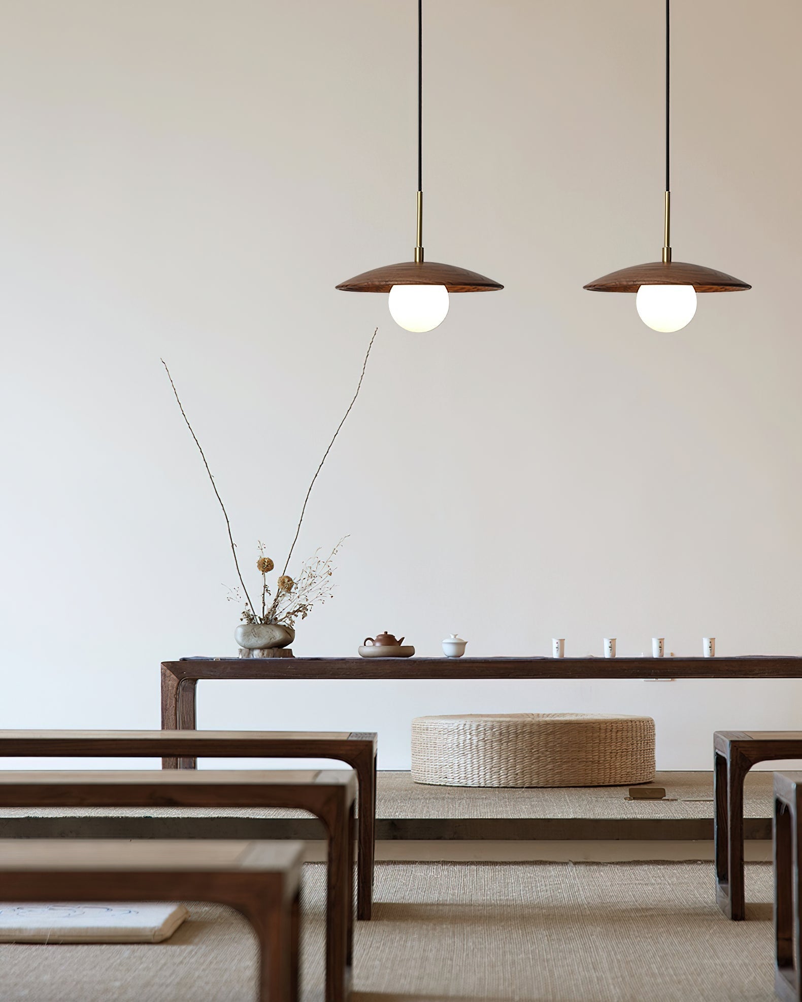 A pair of Caroll Pendant Lights hanging over a kitchen island.