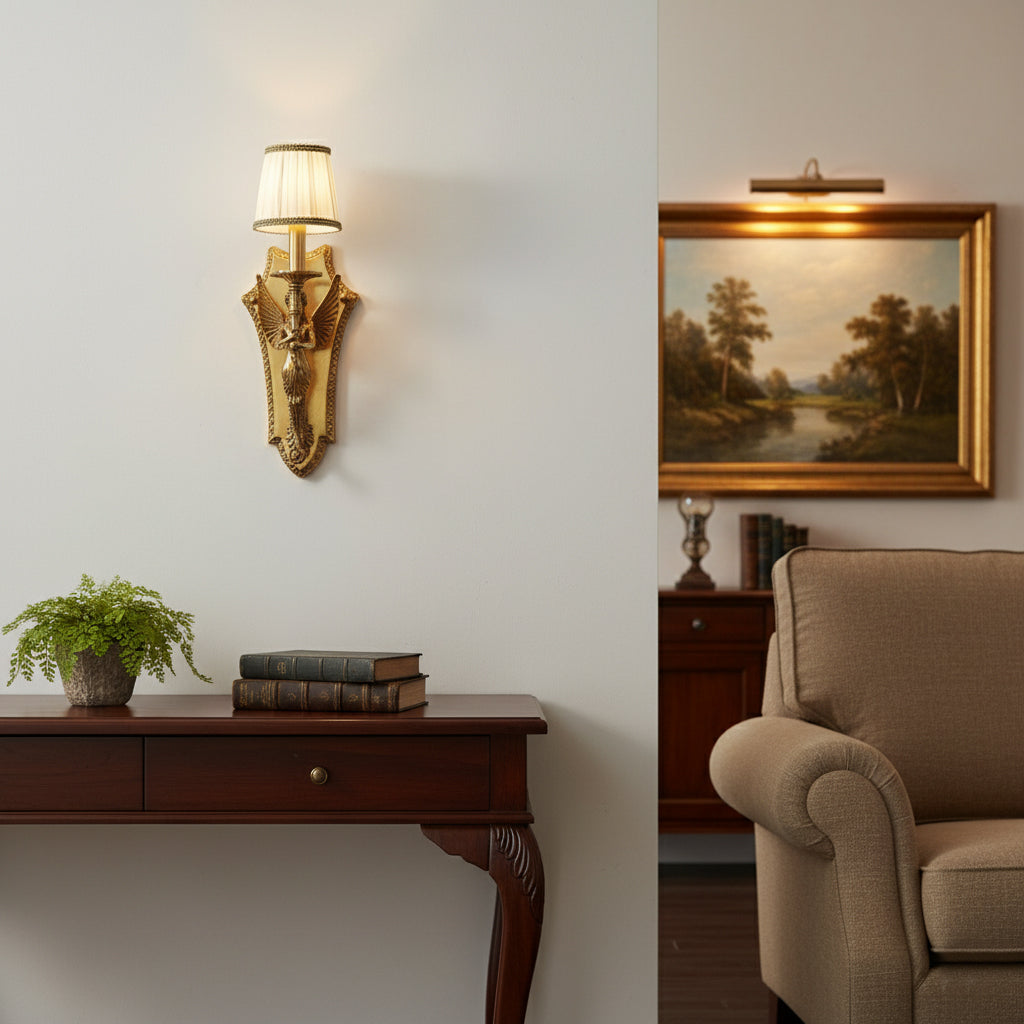 The wall lamp illuminating a living room corner.