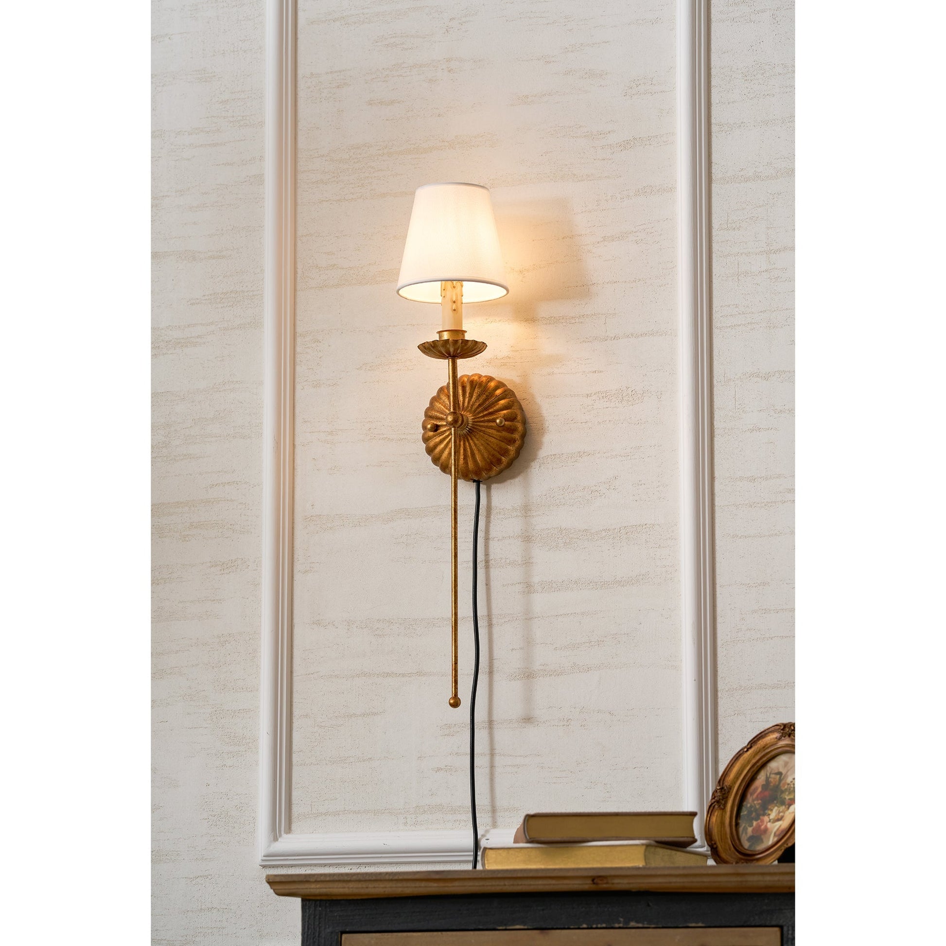 The plug-in wall sconce shown in a white finish.