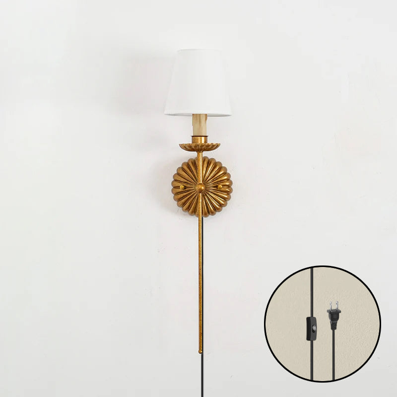 The white sconce against a light, neutral wall color.