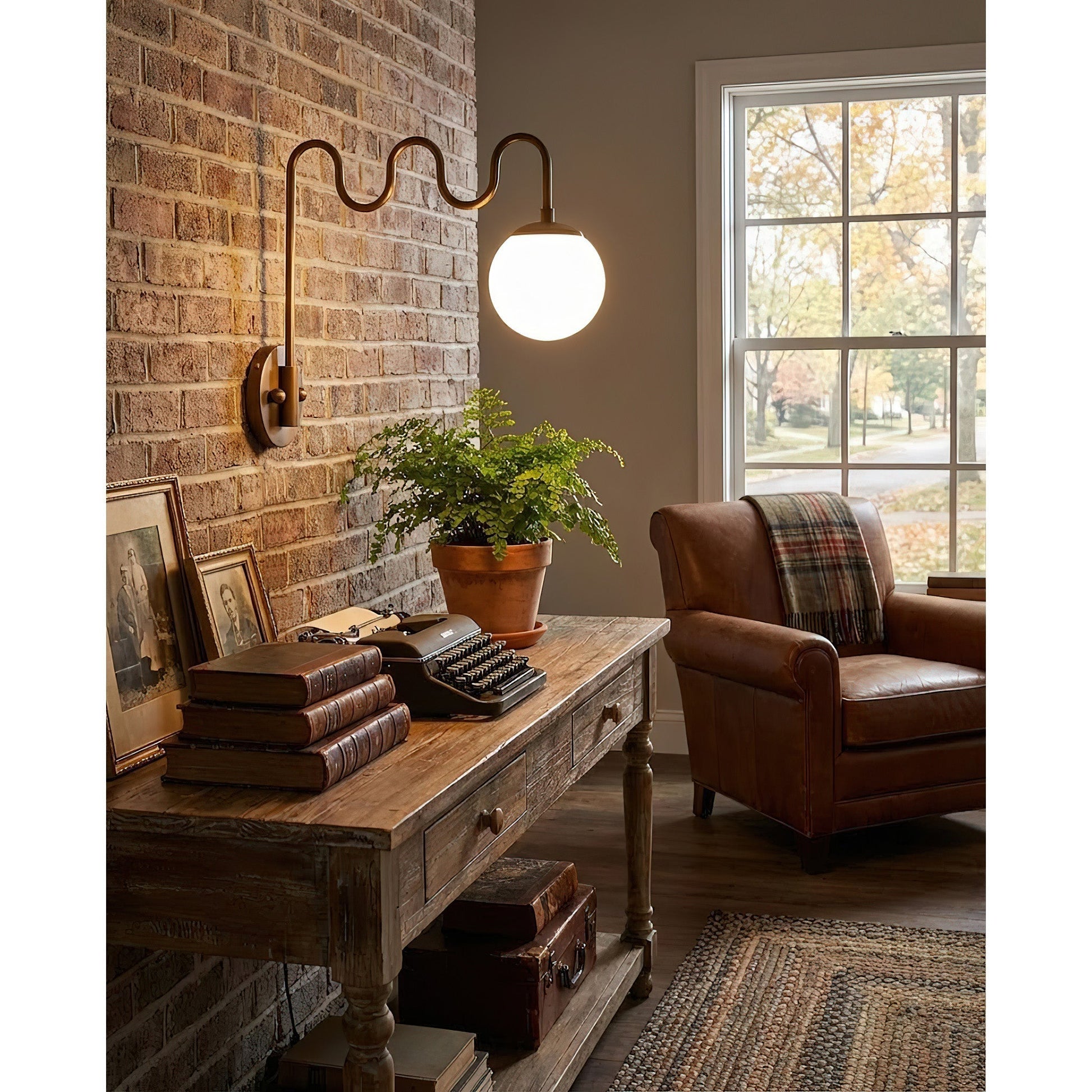 The Cecil Wall Sconce installed in a modern living room setting.