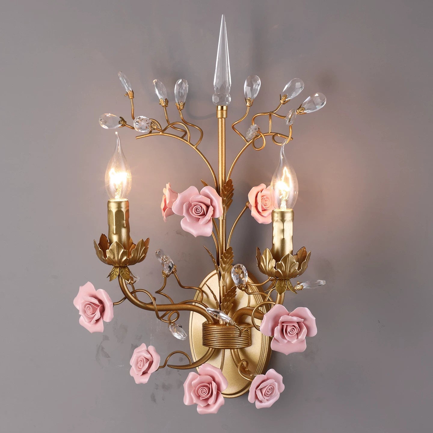 The sconce adding a touch of botanical elegance to a living room wall.