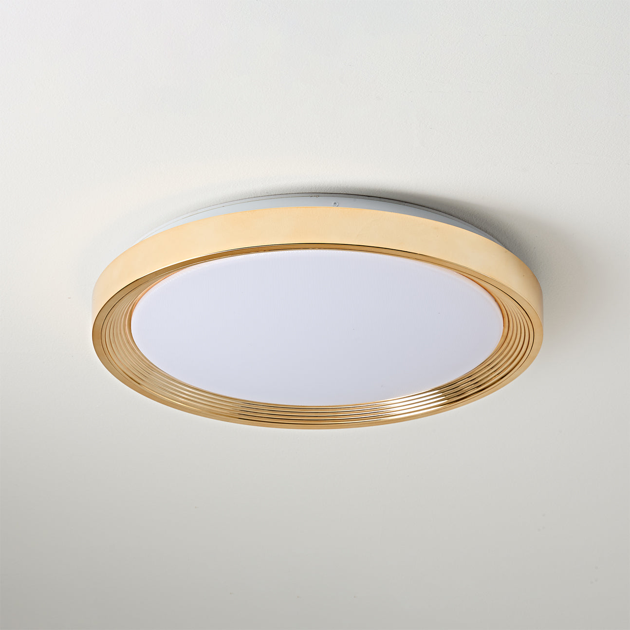 Cerova Ceiling Light in gold finish, turned on.