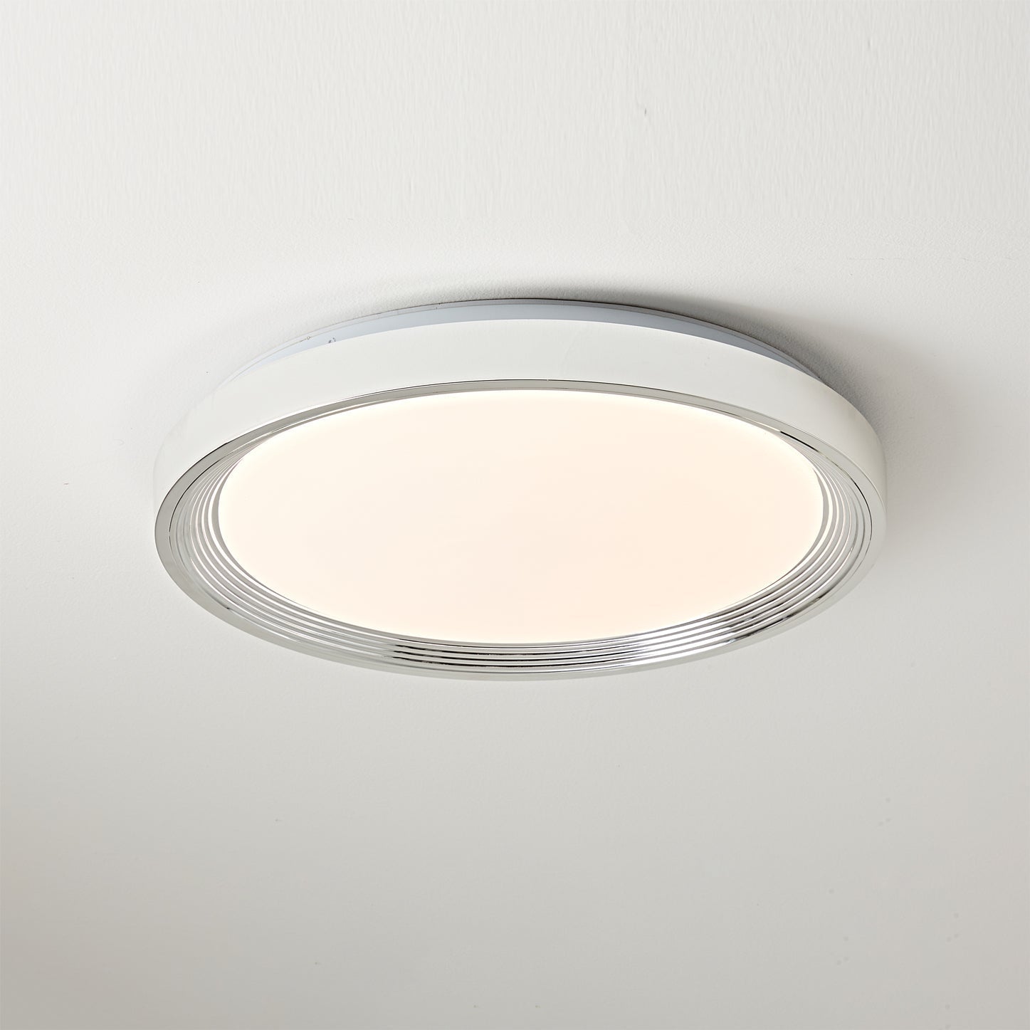 Cerova Ceiling Light in cream finish, turned on.