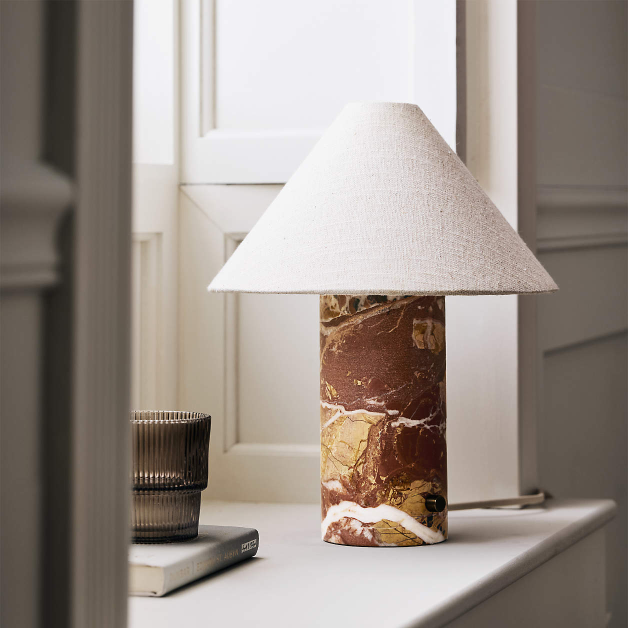 Close-up of the natural veining on the white marble base of the Chez Table Lamp.