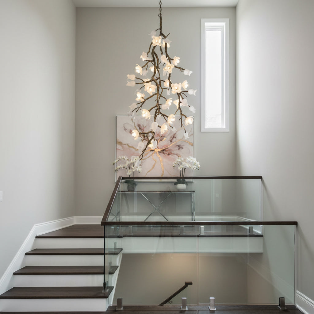 The chandelier shown with a soft satin white finish, blending into a light-colored ceiling.