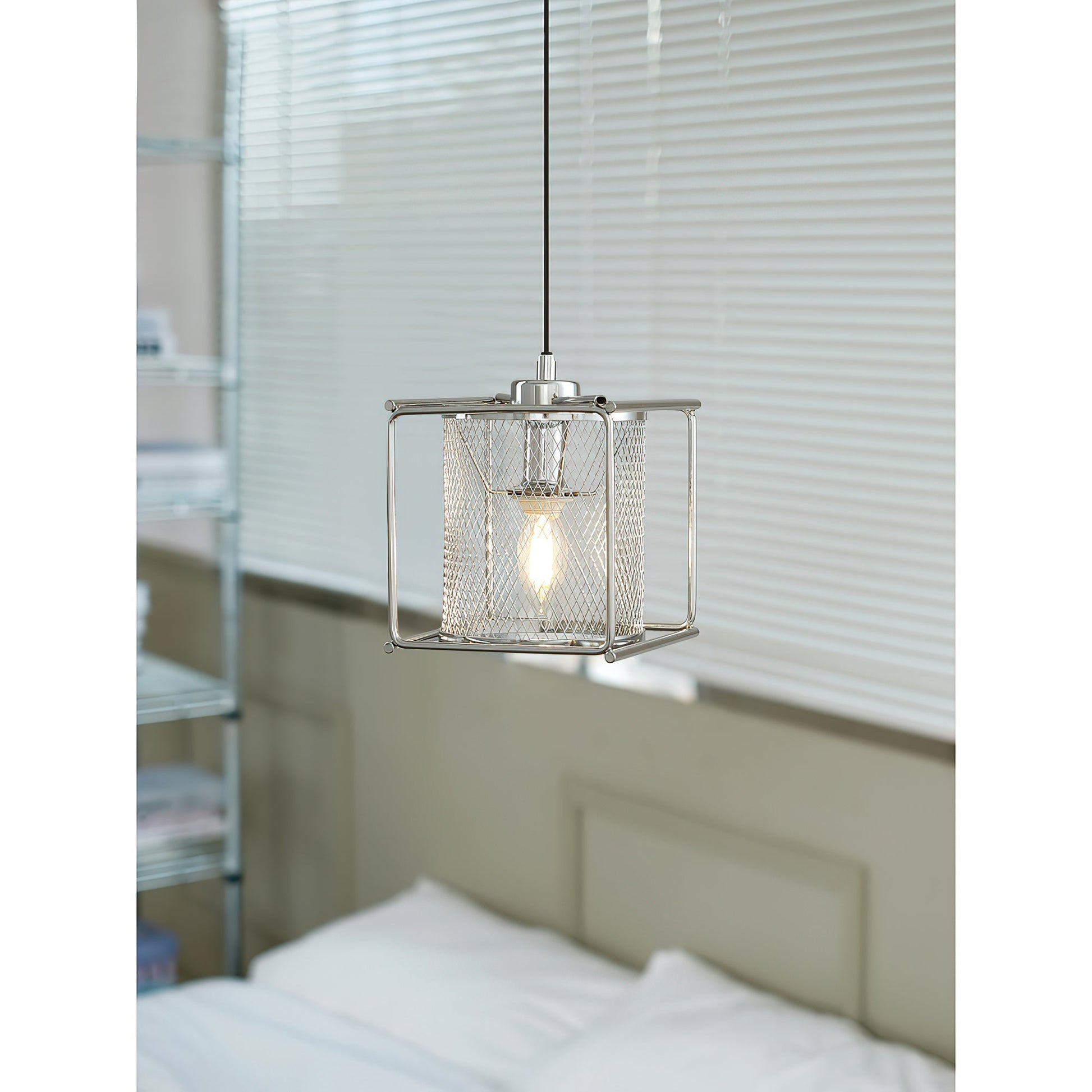 The Clarus Pendant Lamp unlit, highlighting its metallic sheen.