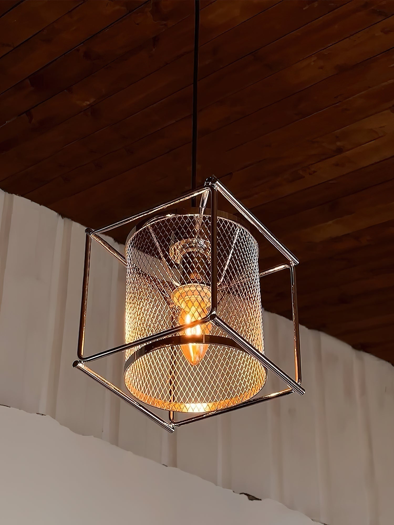 Close-up of the chrome mesh detail on the Clarus Pendant Lamp.