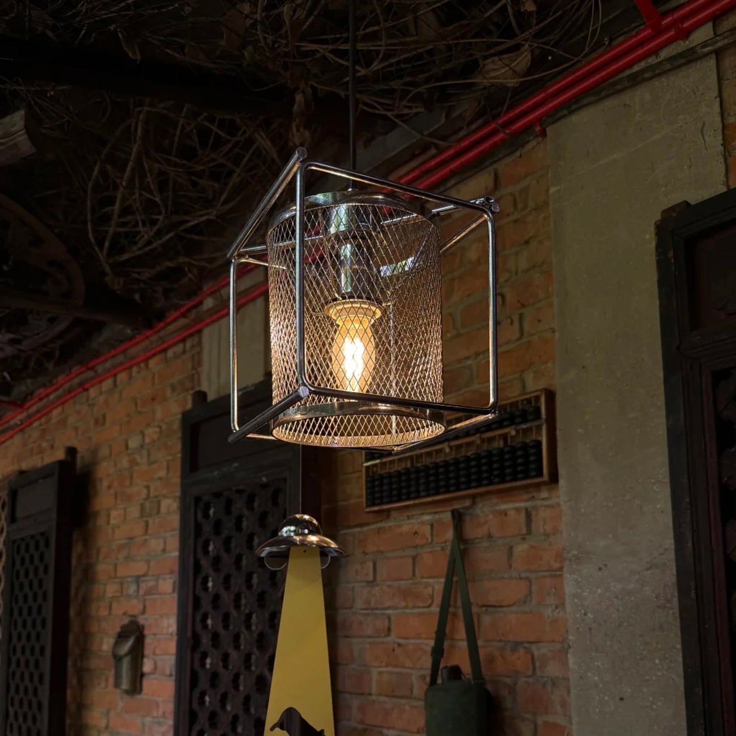The Clarus Pendant Lamp illuminated, showing the soft diffusion of light.