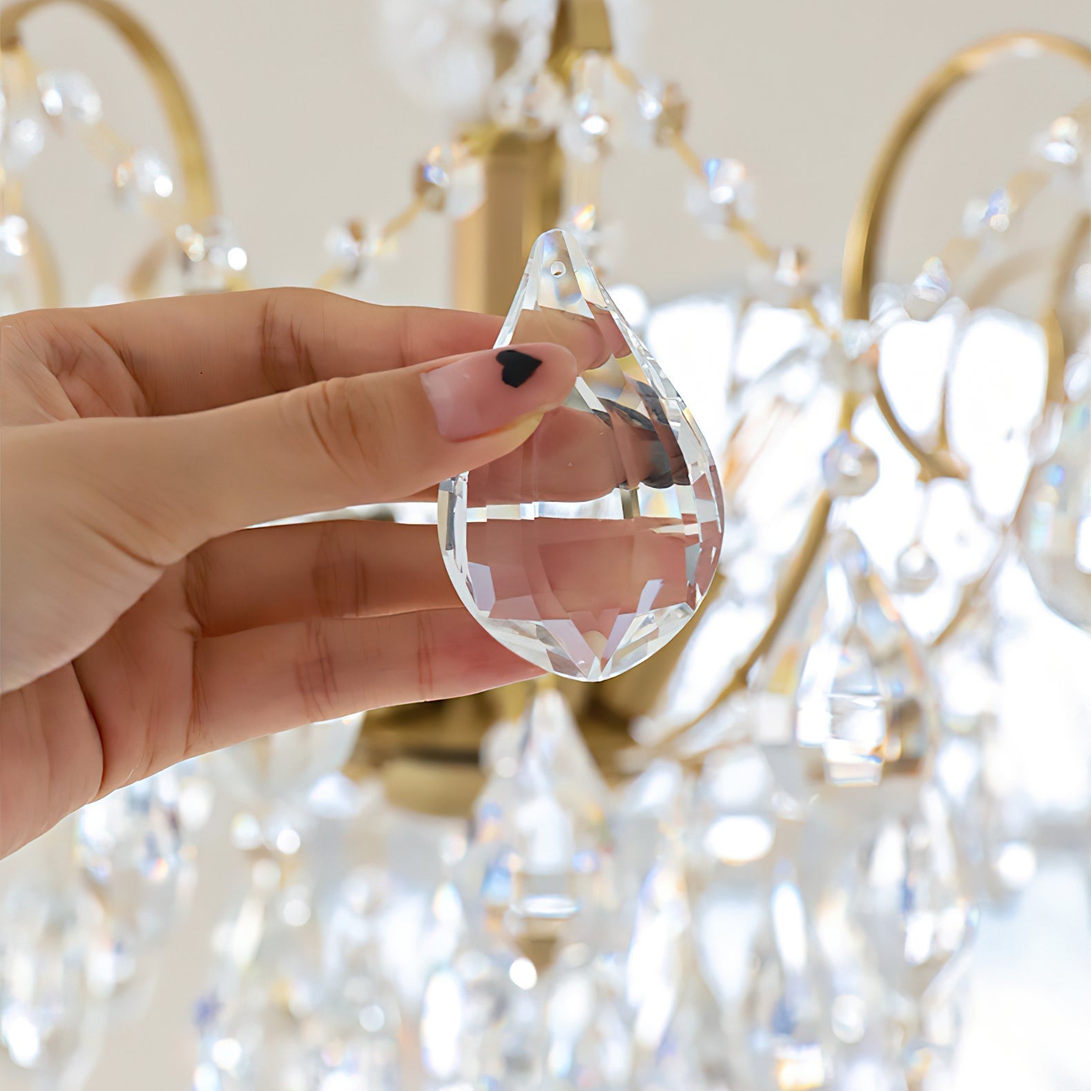 Detail of the gold hanging chain and ceiling mount.