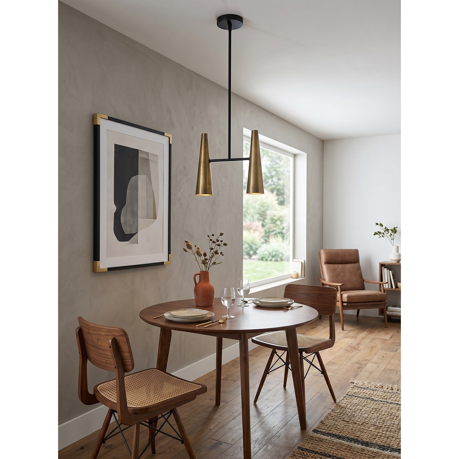 Cono Pendant Lamp in a mixed brass and black finish.