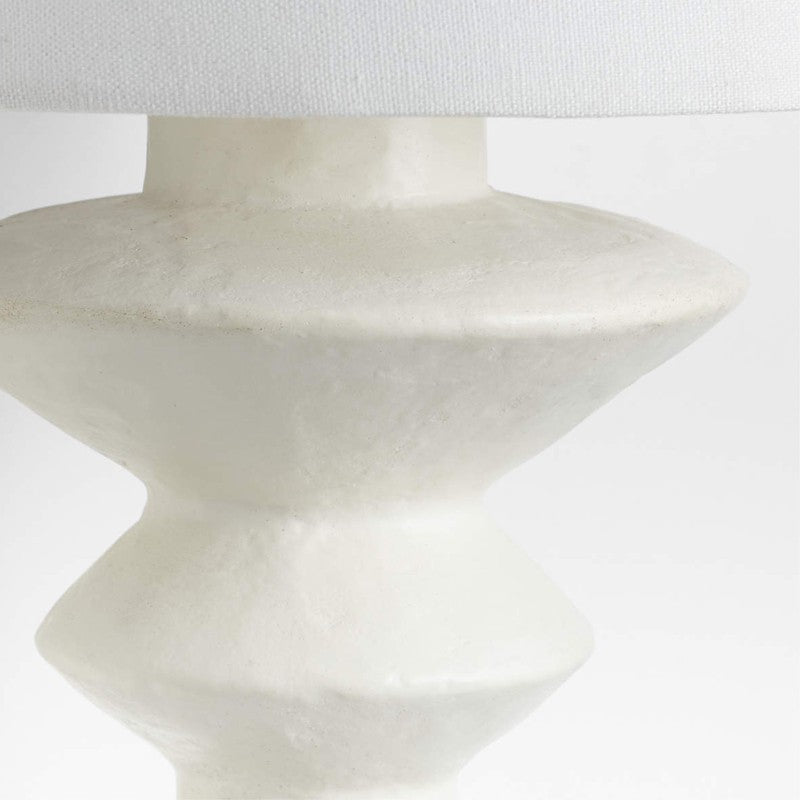 The Constantin Wall Lamp turned on, casting a warm and inviting glow.