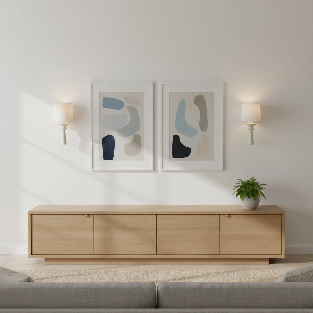 A pair of Constantin Wall Lamps flanking a piece of art in a hallway.