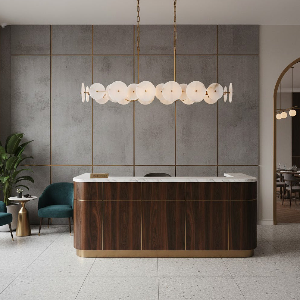 The Selene chandelier emitting a warm glow over a dining table.