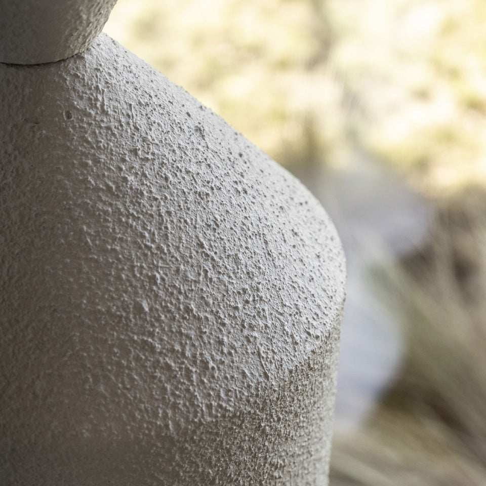 The white Costantina Floor Lamp in a bright, minimalist space.