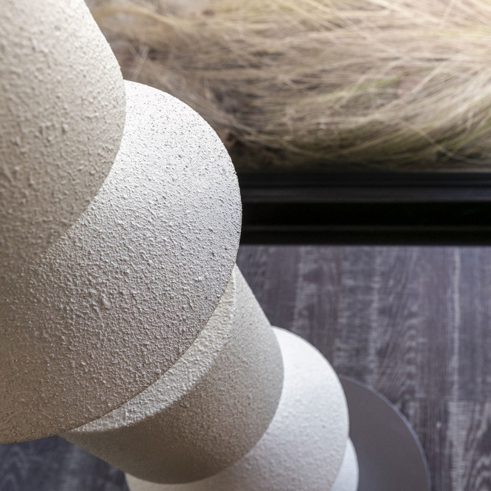 The wood color Costantina Floor Lamp adding a natural touch.