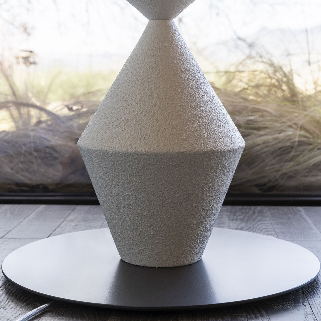 Detail of the plug options for the Costantina Floor Lamp.