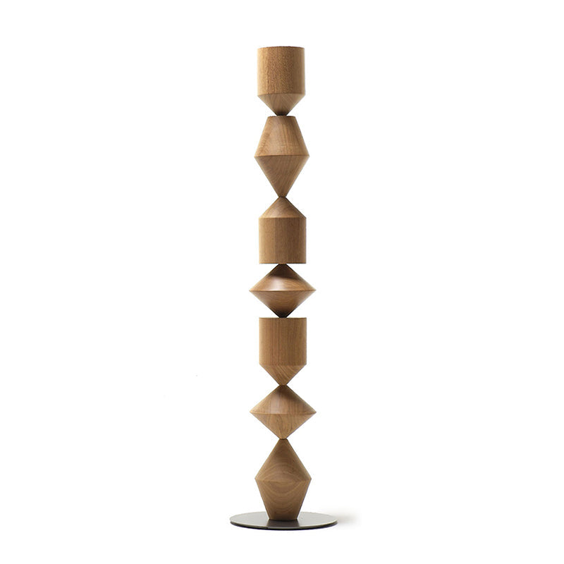 The black Costantina Floor Lamp against a neutral wall.