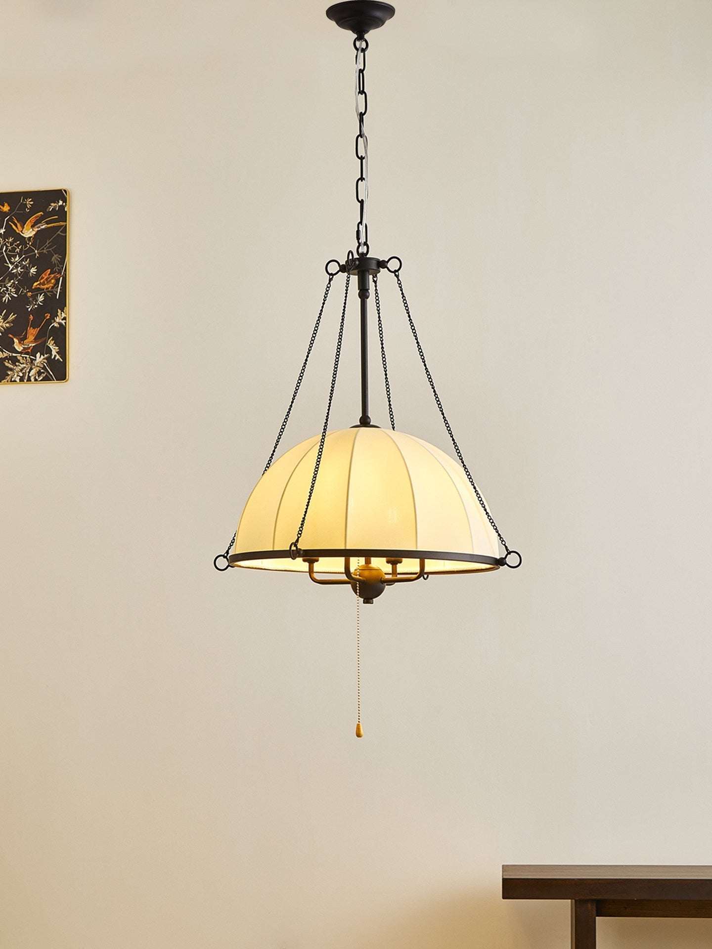 Covina Pendant Lamp hanging over a dining table.