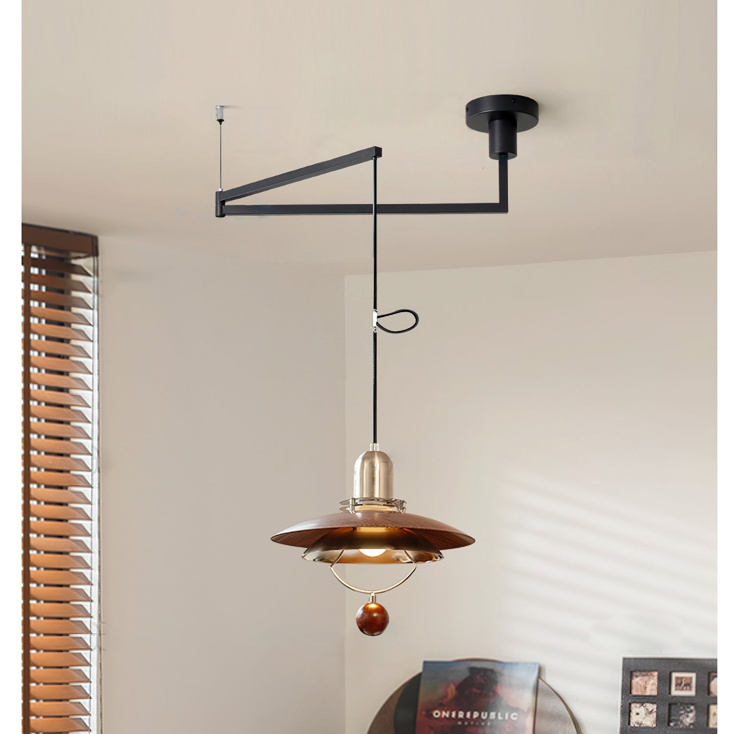 Close-up of the Cullen Pendant Light's layered metal shade and wood detail.