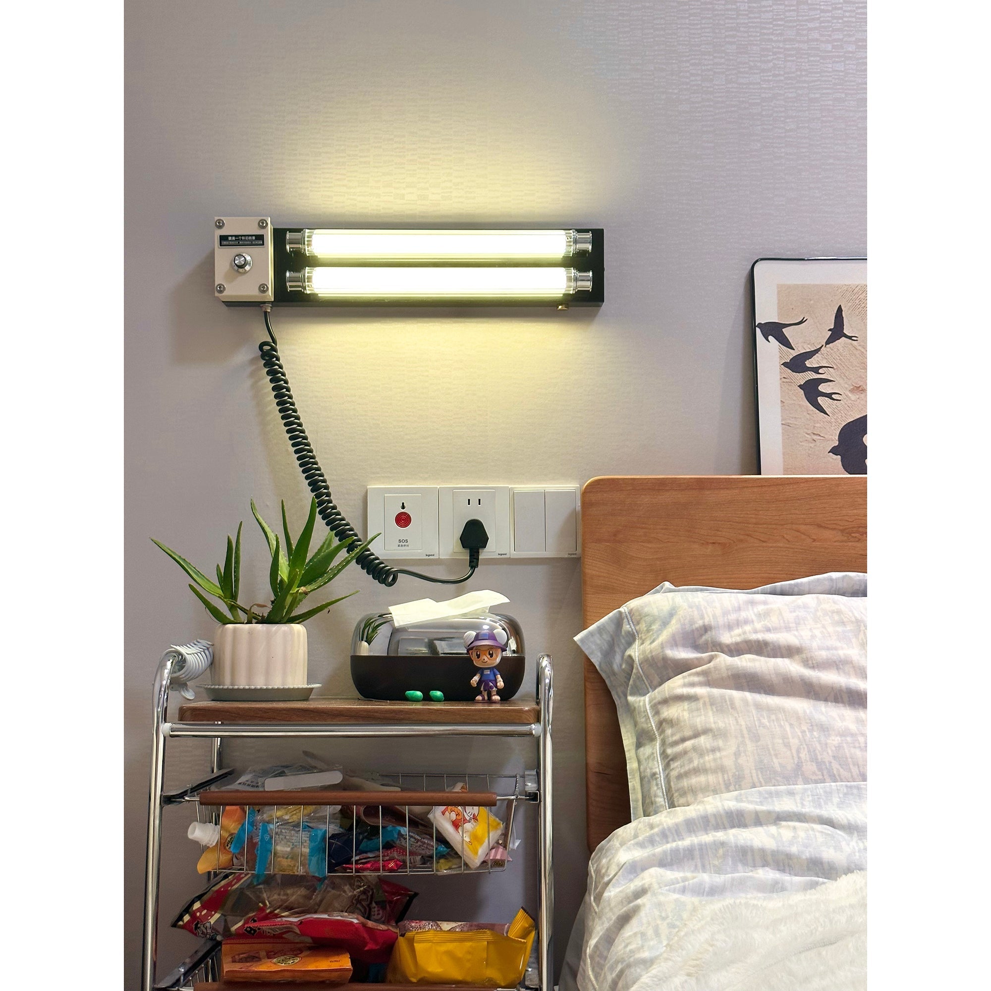 Cutshall Plug-in Wall Lamp, black, side view.
