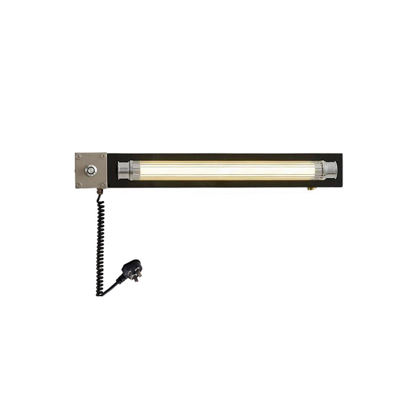 Black finish Cutshall lamp against a light wall.