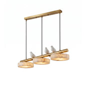 Sienna Bird Alabaster Chandelier in brass finish over a dining table.